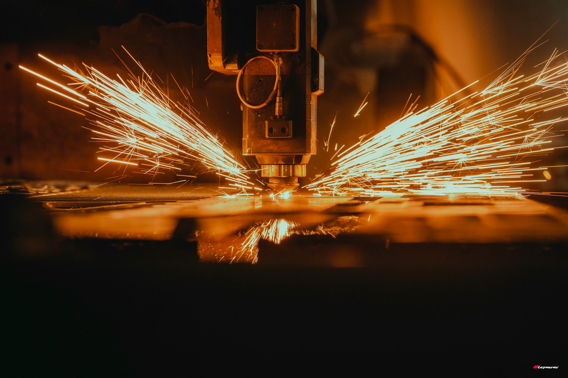 a piece of metal being cut with a machine